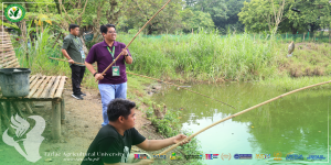 𝐂𝐀𝐏𝐓𝐔𝐑𝐄𝐃 𝐈𝐍 𝐋𝐄𝐍𝐒 | The Tarlac Agricultural University (TAU) President Dr. Silverio Ramon DC. Salunson joins the students, faculty, staff, and stakeholders as they fish on one of the University's 13 ponds on 29 August.
